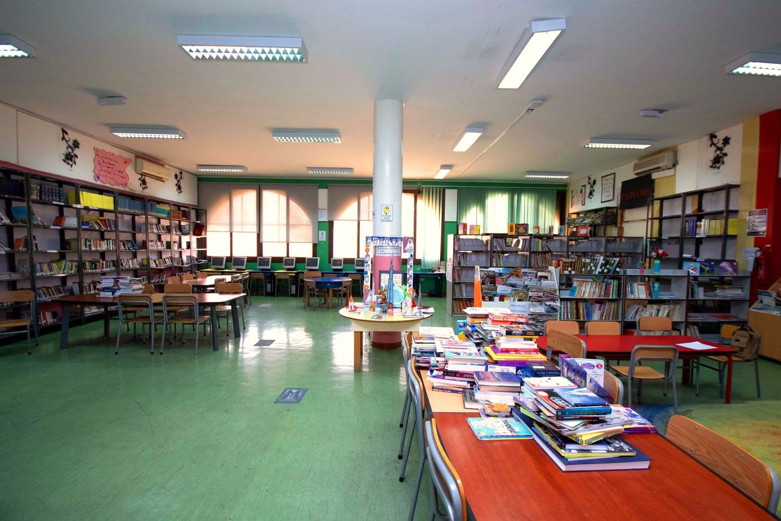 The library's long reading room with displays of new books