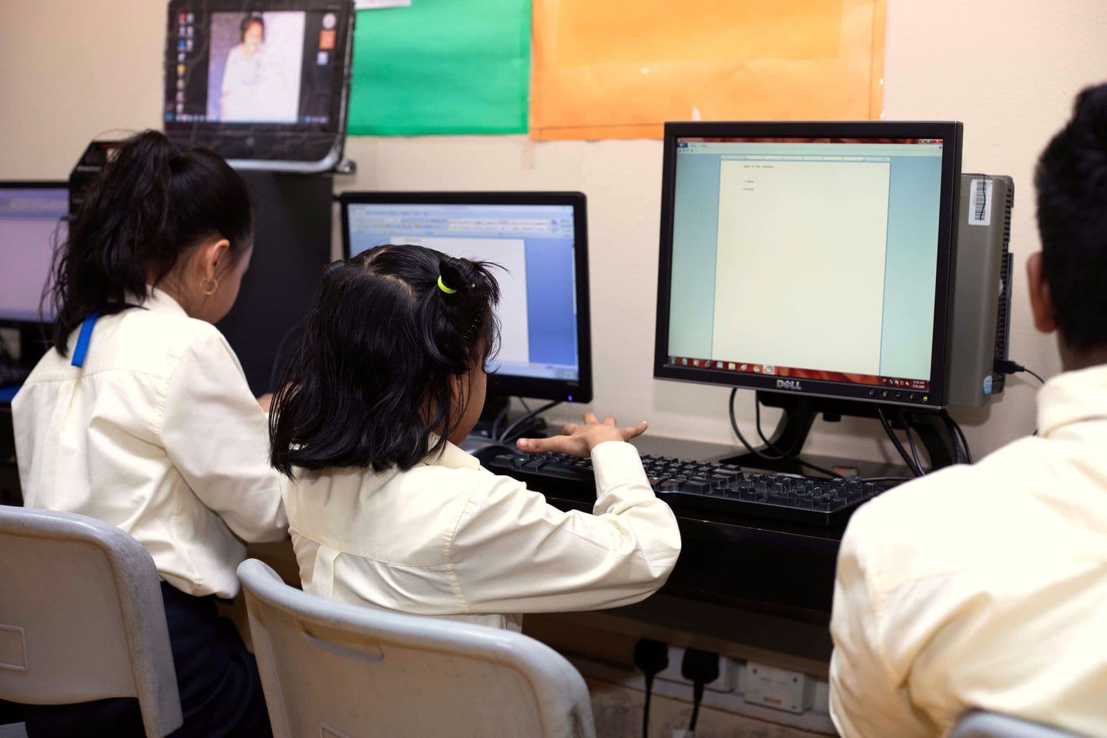Students typing at computers in the computer lab