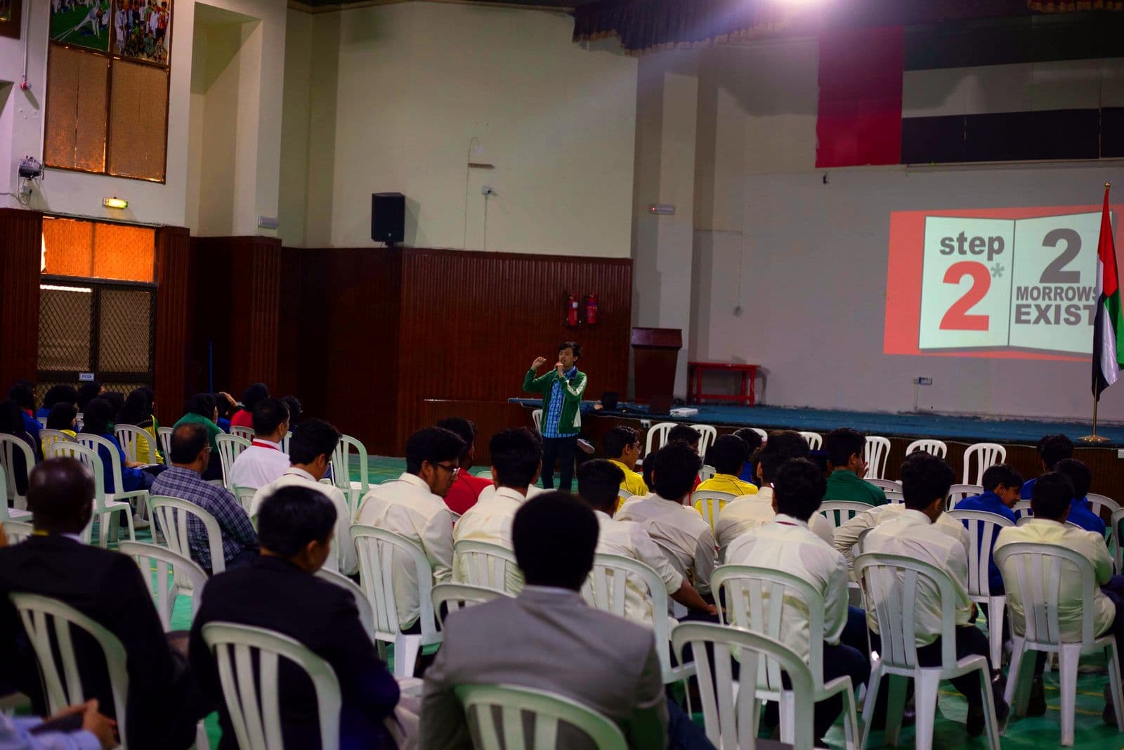 Students and parents seated for a presentation in the multipurpose auditorium