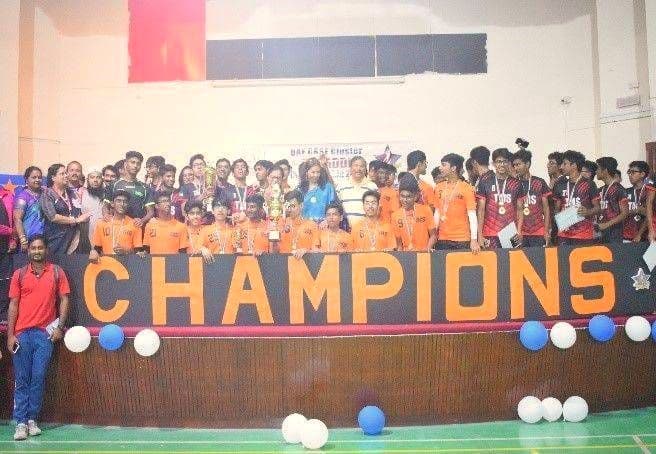Students celebrating behind a CHAMPIONS banner at the UAE CBSE Cluster Kabaddi Championship